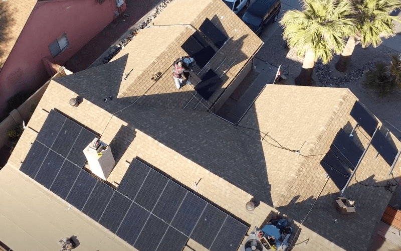 solar panel workers installing solar panels